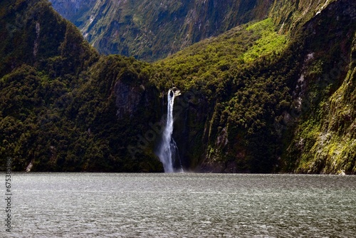 Majestic waterfall cascades down a rushing river