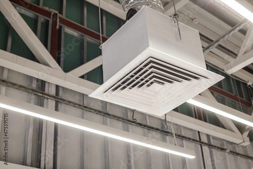 Square grid with supply ventilation duct in commercial building. Industrial ventilation system
