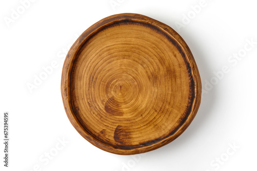 Handmade wooden brown plate isolated on white background. Top view with copy space