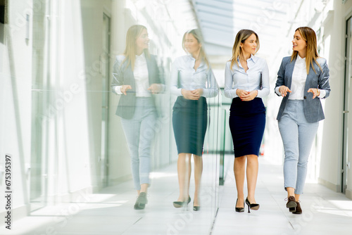 Two young business women wa...