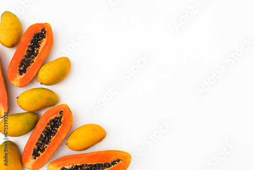 Tasty papaya and mango fruits on white background. Flat lay. Top view