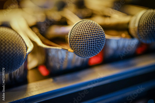 Closeup of Microphones Sitting on a Desk in Metal Tins