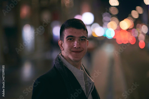 Smiling Meedle Eastern man walking down street near modern office building, © .shock