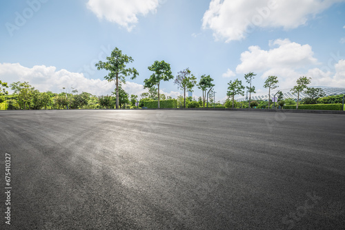 Clean asphalt road and woods background © zhao dongfang