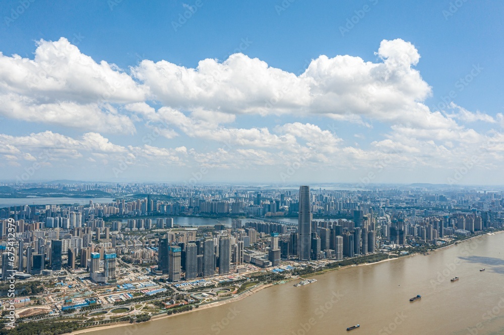 Aerial view of Wuhan skyline in China with modern skyscrapers along the Yangtze River