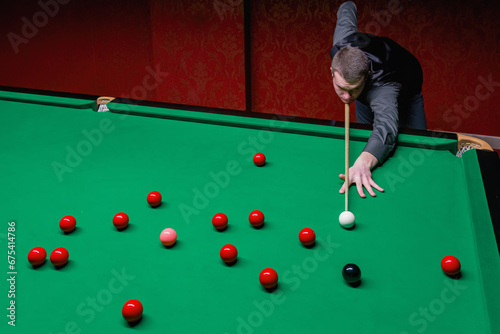 Obraz na plátne A skilled snooker player engaged in a captivating game of precision and strategy