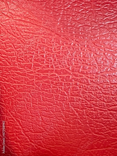 Closeup shot of a red leather surface.