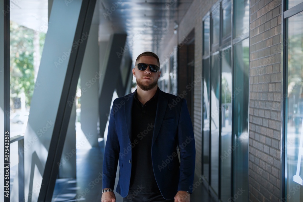 Confident young businessman on street outdoor city background Confident young businessman on street outdoor city background