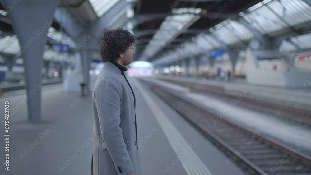 Headshot Of Indian Man With Glasses Commuting In Train Station