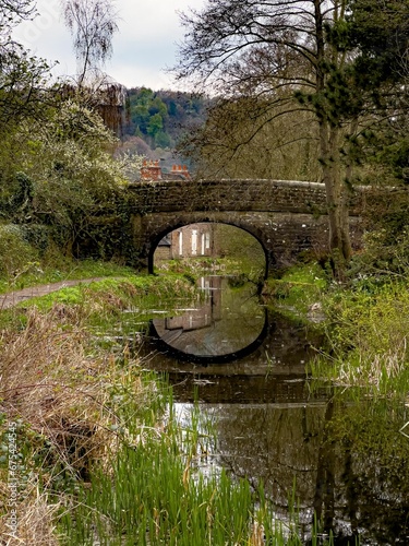 Fotografía Old bridge reflected in a still body of water