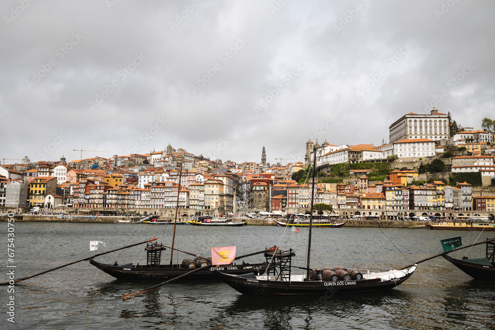 Panoramic view of Porto with Duoro river on a cloudy day, Porto cityscape with boats
