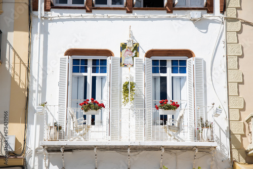 Facade of vintage white balcony in Spain