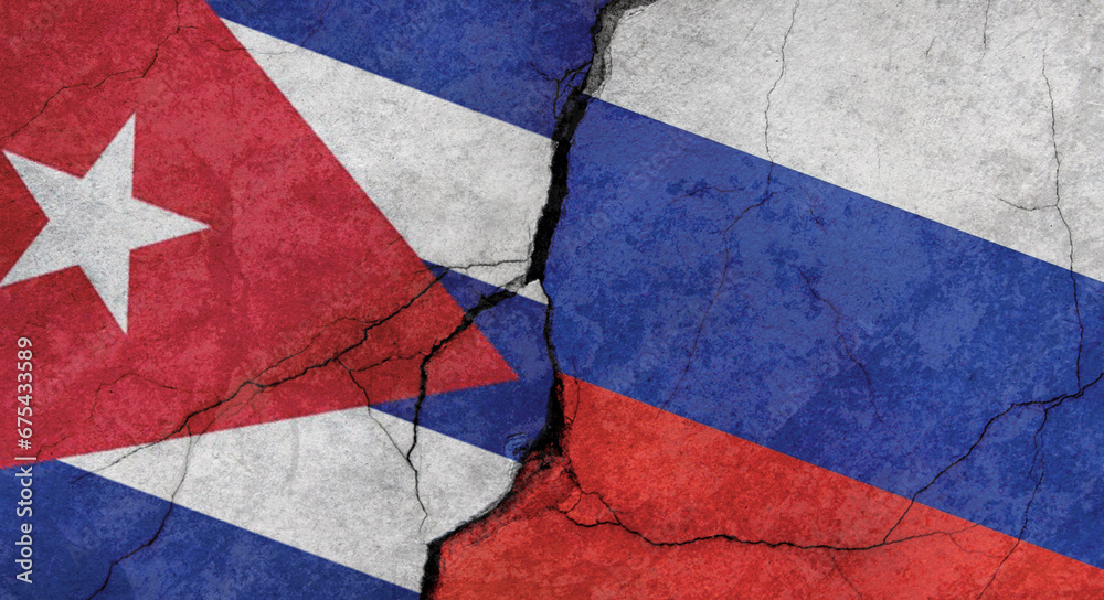 Flags of Cuba and Russia, texture of concrete wall with cracks, grunge background, military conflict concept
