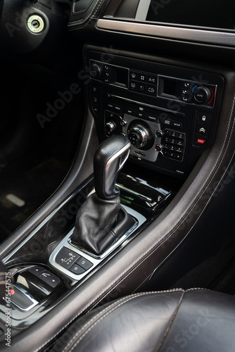 Close-up of an automatic transmission lever. Car interior, automatic transmission gear knob.