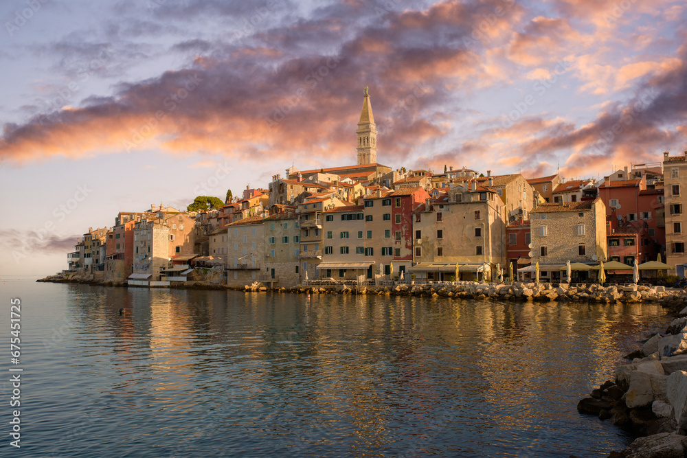 Sunset in Rovinj,  Croatia on the west coast of the Istrian peninsula. Colorful evening seascape of Adriatic Sea. Traveling concept background.