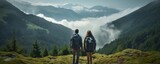 Couple of hikers enjoy nature view. Hiking and digital detox concept. Contemplation of nature alone with your thoughts. Slow life.