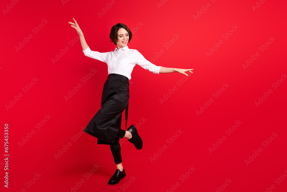 Full size photo of charming nice young funky woman dance smile hostess isolated on red color background
