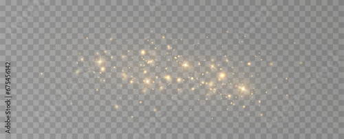 Golden sequins glow with many lights. Glittering dust. Luxurious background of golden particles.	