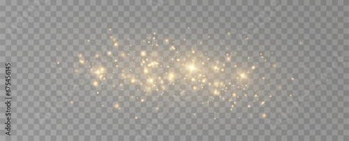 Golden sequins glow with many lights. Glittering dust. Luxurious background of golden particles. 