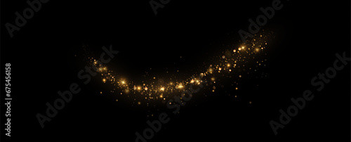 Golden sequins glow with many lights. Glittering dust. Luxurious background of golden particles.	