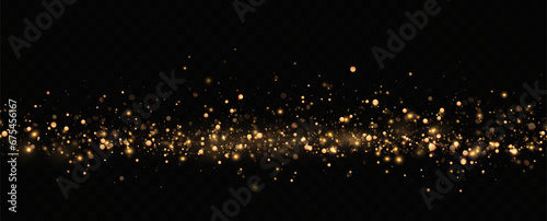 Golden sequins glow with many lights. Glittering dust. Luxurious background of golden particles.  © blagorodez