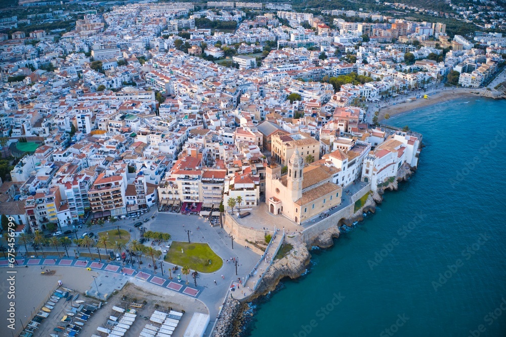 an aerial view of a town and its waterfront including water