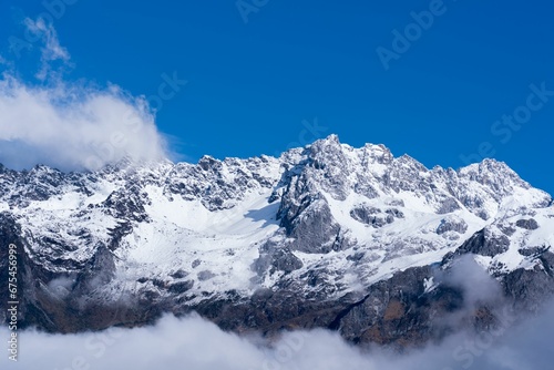 Landscape of the Jade Dragon Snow Mountain covered in fog in China