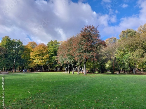 A walk on a sunny autumn day in a city park.