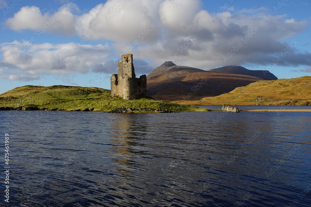 The Ruin of 16th Century Ardvreck Castle sat on a Rocky Promontory in Loch Assynt, Sutherland, Scotland with Glas Bheinn (776m) behind.