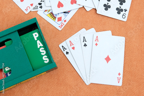Playing cards, card boxes, pens. Concept gambling, sports bridge, poker. Sport equipment.
