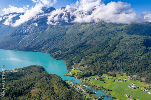 Aerial view above the mountains, fjords and lakes of Norway during summer  © Mike Workman
