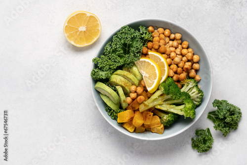 Buddha bowl salad with chickpeas, avocado, kale, broccoli and pumpkin. Healthy Seasonal Vegan Eating