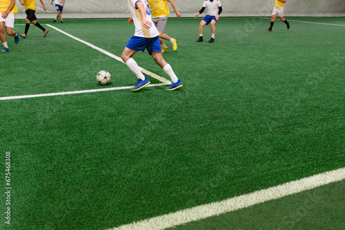 Fototapeta Naklejka Na Ścianę i Meble -  Futsal players rivals in action. Sport mini soccer futbol sala concept.