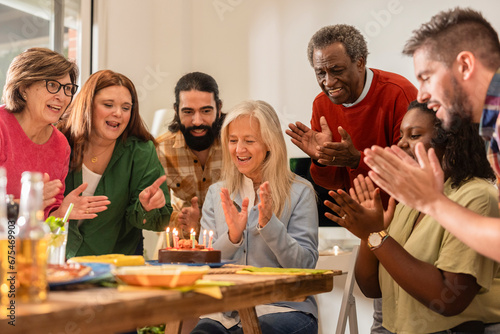 multiracial diverse family birthday party of different ages