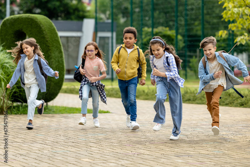 Happy kids running at the school yard