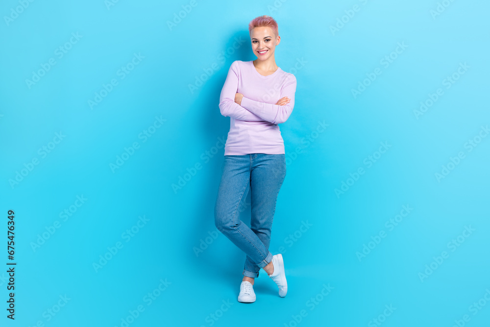 Full body length cadre of young satisfied hr recruitment girl folded arms wear trendy apparel model isolated on blue color background Full body length cadre of young satisfied hr recruitment girl folded arms wear trendy apparel model isolated on blue color background