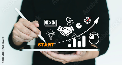 man touching on tablet. Startup concept with icon business and network connection on modern virtual interface from digital tablet.