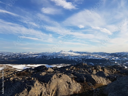 Breath-taking view of a picturesque snow-capped mountain range in the distance