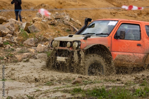 offroad car driving on track in dirt. adventure offroad racing