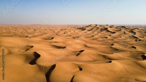 Vast Nomadic desert of the UAE under the blue sky