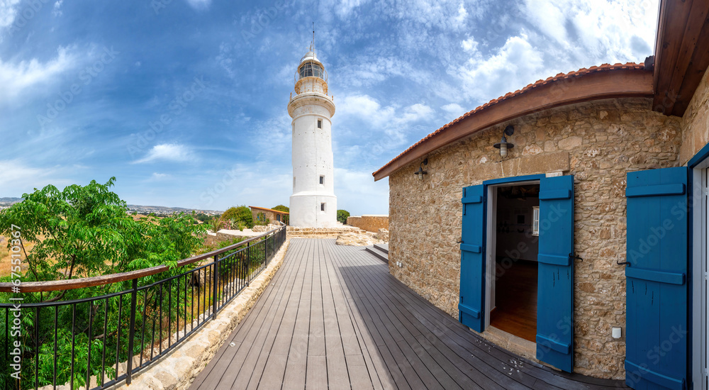 Cyprus attractions. Paphos resort. White lighthouse. Sights of Cyprus. British lighthouse in Paphos. Cyprus in sunny weather. Lighthouse under blue sky. Guide Paphos. Mediterranean cities