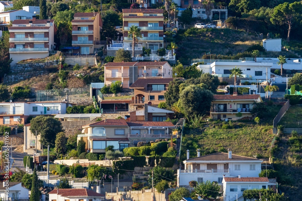 Houses build on the slope of a mountain hill in Catalonia, Spain