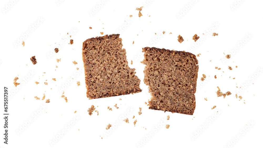 Broken slice of dark rye bread with crumbs flying isolated on white - obrazy, fototapety, plakaty 
