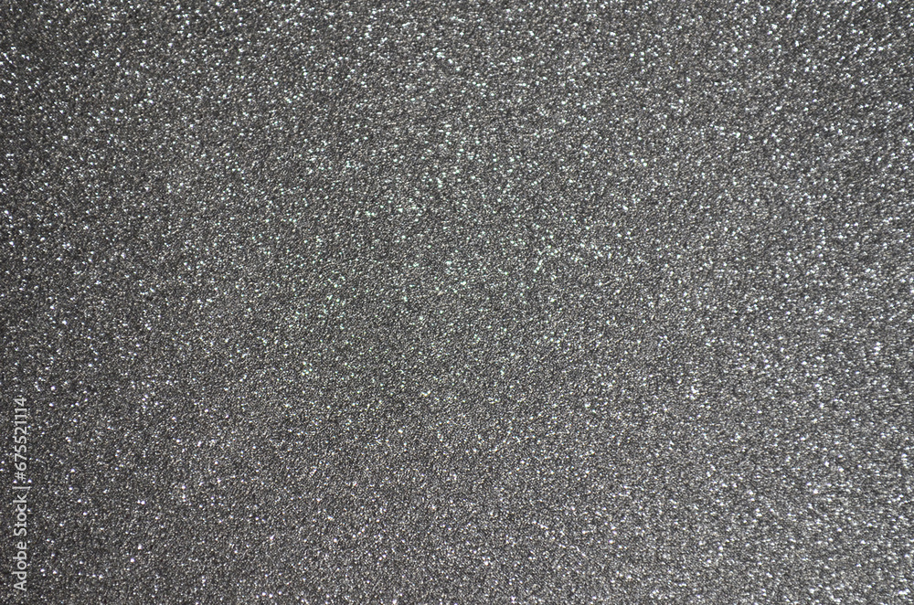 Fondo de brillos / textura glitter de color gris plateado. Se puede usar como fondo de año nuevo o navidad.