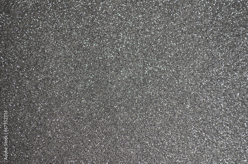 Fondo de brillos / textura glitter de color gris plateado. Se puede usar como fondo de año nuevo o navidad.