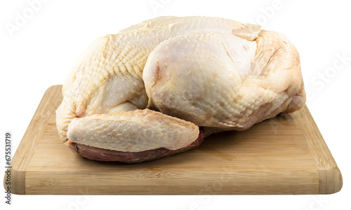 raw chicken on wooden board