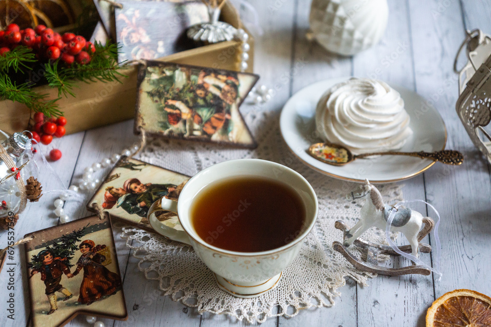 A cup of tea, New Year's toys, a calendar for the New Year 2024. Still life in vintage style. A cup of tea, New Year's toys, a calendar for the New Year 2024. Still life in vintage style.
