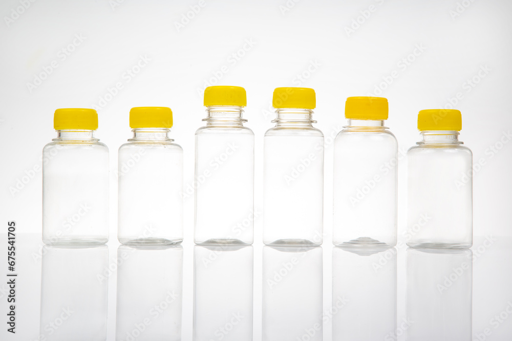 five transparent plastic bottles on a light background five transparent plastic bottles on a light background