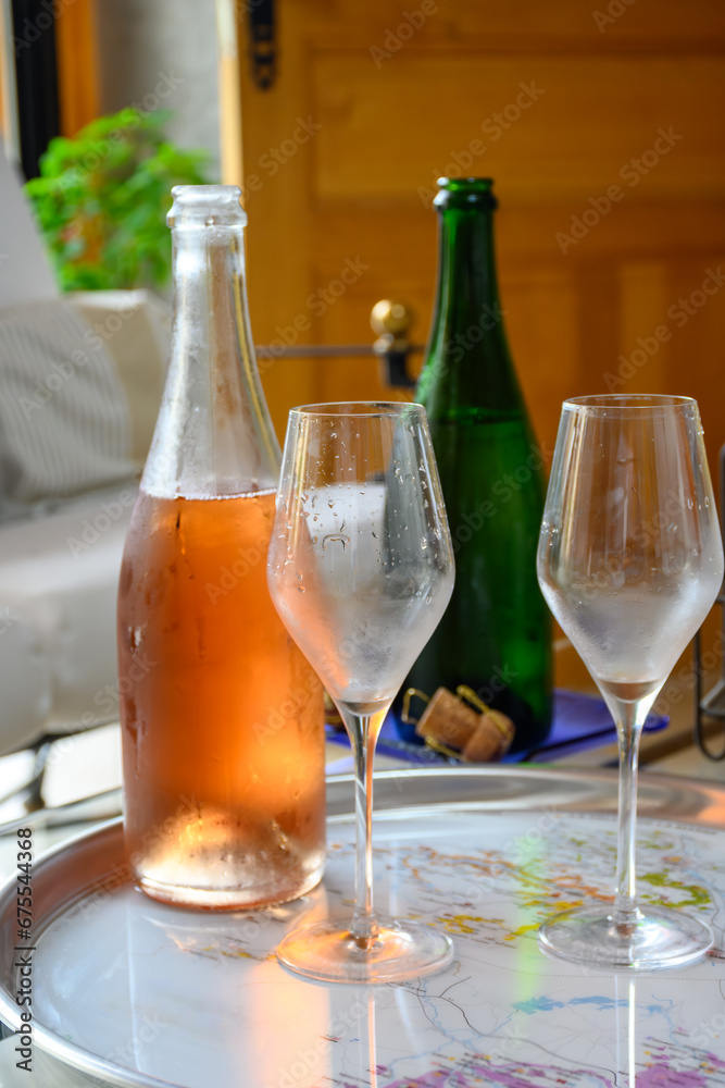 Tasting of grand cru sparkling white wine with bubbles champagne in old champagne house in grand cru wine producer small village Ambonnay, Champagne, France