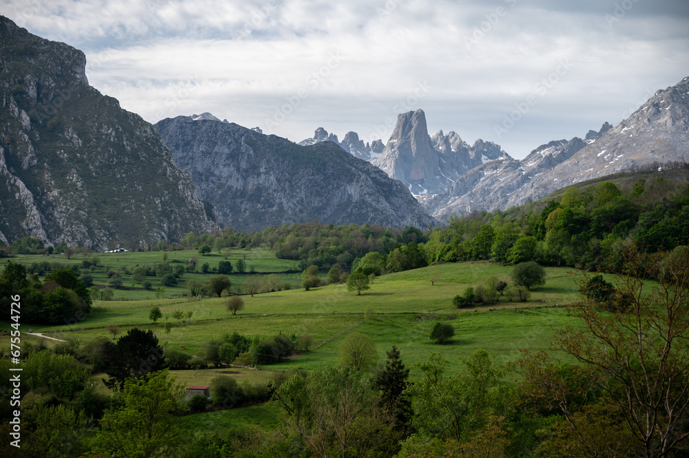 Fototapeta premium Panoramic view on Naranjo de Bulnes or Picu Urriellu, limestone peak dating from Paleozoic Era, located in Macizo Central region of Picos de Europa, mountain range in Asturias, North Spain